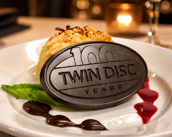 Plated dessert toppers for an automotive supplier's 100th